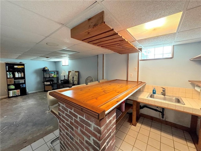823 Irwin Dr, Baldwin Boro, PA 15236 - bar featuring a paneled ceiling and light tile patterned flooring