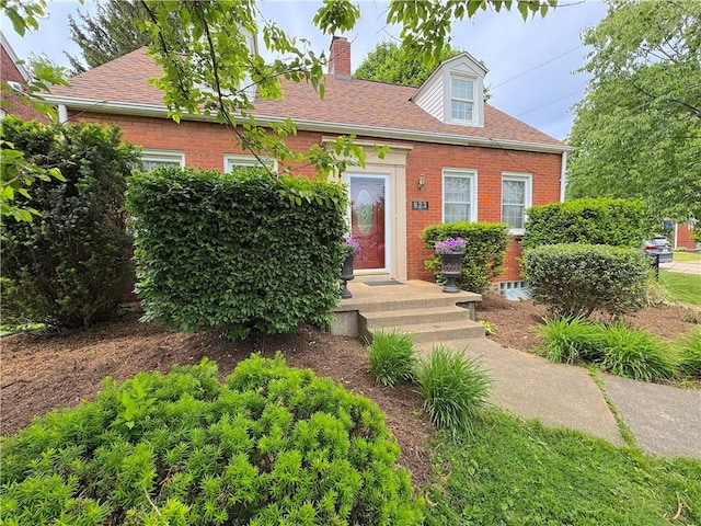 823 Irwin Dr, Baldwin Boro, PA 15236 - cape cod home with brick siding, a chimney, and a shingled roof