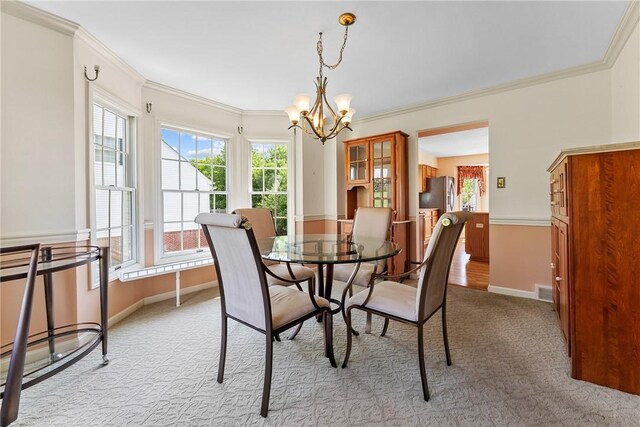 16 Mcbride Rd, North Strabane, PA 15317 - dining space with a chandelier, ornamental molding, light carpet, and baseboards