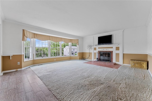 16 Mcbride Rd, North Strabane, PA 15317 - unfurnished living room featuring a fireplace, baseboards, ornamental molding, and wood finished floors