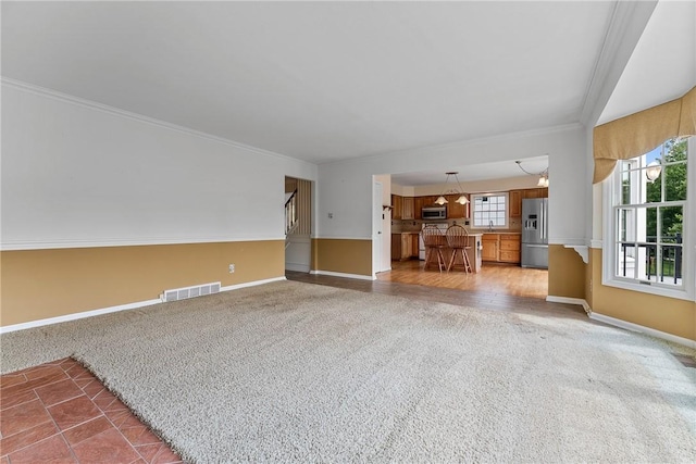 16 Mcbride Rd, North Strabane, PA 15317 - unfurnished living room featuring carpet flooring, baseboards, and ornamental molding