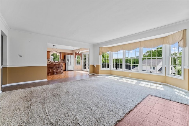 16 Mcbride Rd, North Strabane, PA 15317 - unfurnished living room with crown molding, baseboards, light carpet, and a chandelier