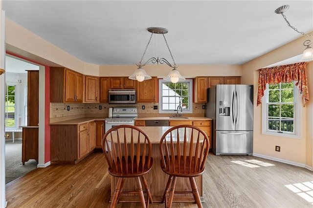 16 Mcbride Rd, North Strabane, PA 15317 - kitchen featuring appliances with stainless steel finishes, a sink, light countertops, and light wood-style floors