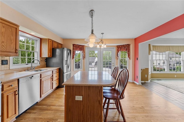 16 Mcbride Rd, North Strabane, PA 15317 - kitchen with dishwasher, a sink, a chandelier, a breakfast bar area, and a center island