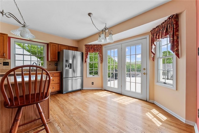 16 Mcbride Rd, North Strabane, PA 15317 - kitchen featuring stainless steel fridge with ice dispenser, brown cabinetry, baseboards, and light wood-style floors