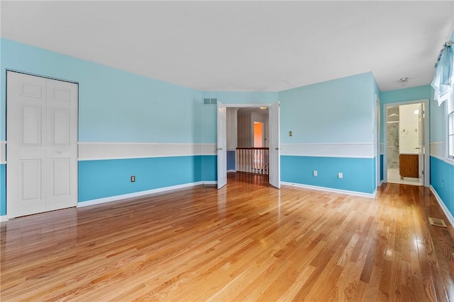 16 Mcbride Rd, North Strabane, PA 15317 - unfurnished bedroom with wood finished floors, baseboards, and connected bathroom