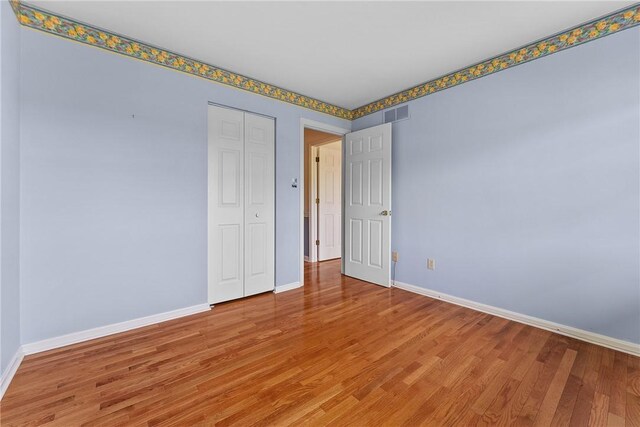 16 Mcbride Rd, North Strabane, PA 15317 - unfurnished bedroom with baseboards, light wood finished floors, and a closet