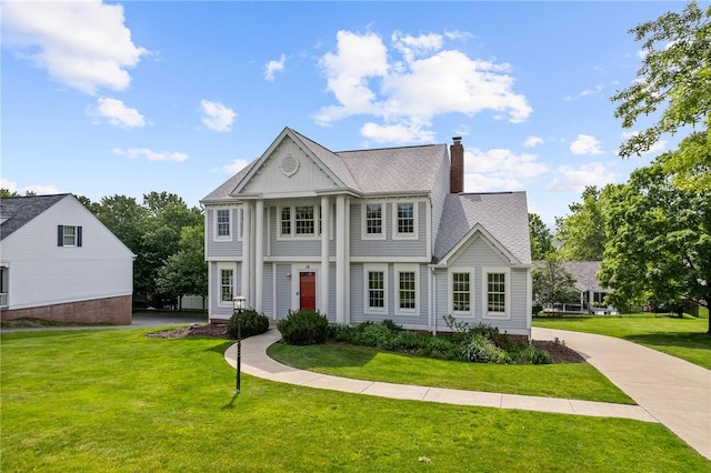 16 Mcbride Rd, North Strabane, PA 15317 - neoclassical / greek revival house with a chimney, a front yard, and a shingled roof