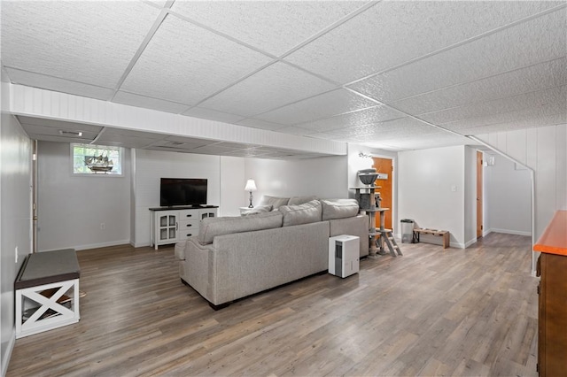 2418 Graceland Rd, Neshannock Twp, PA 16105 - living area featuring wood finished floors, baseboards, and a drop ceiling
