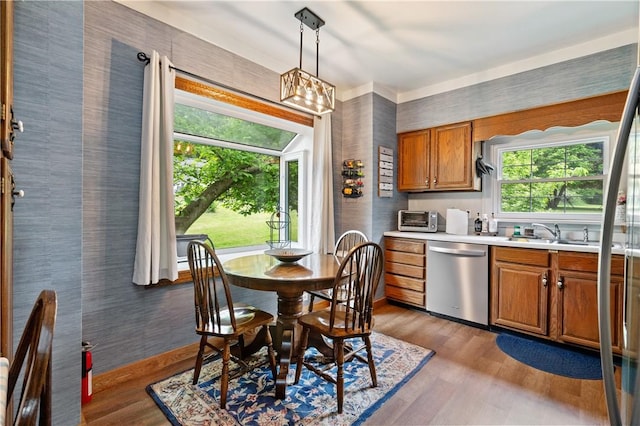 2418 Graceland Rd, Neshannock Twp, PA 16105 - dining room with wood finished floors, wallpapered walls, and a chandelier