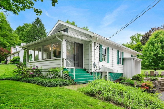2418 Graceland Rd, Neshannock Twp, PA 16105 - view of front of home with a sunroom and a front yard