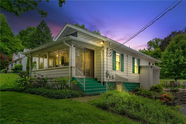2418 Graceland Rd, Neshannock Twp, PA 16105 - view of front of home with a front lawn and a sunroom