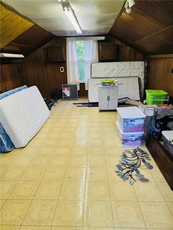 2418 Graceland Rd, Neshannock Twp, PA 16105 - bedroom with wooden walls, lofted ceiling, light floors, and wood ceiling