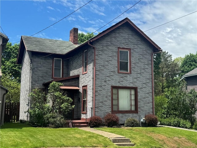 509 N Mercer St, New Castle/1St, PA 16101 - view of front of home featuring a chimney, a front yard, and brick siding