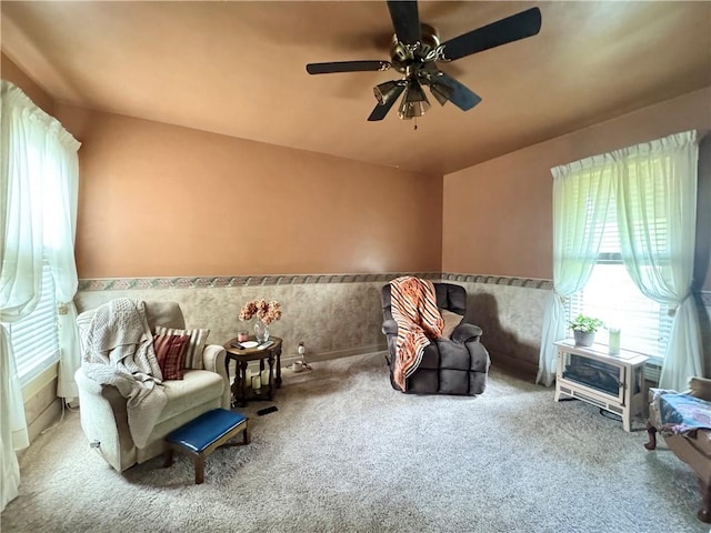 509 N Mercer St, New Castle/1St, PA 16101 - living area featuring carpet floors, ceiling fan, and wainscoting
