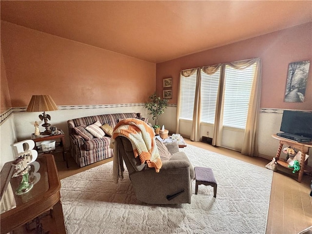 509 N Mercer St, New Castle/1St, PA 16101 - living room featuring wood finished floors and lofted ceiling