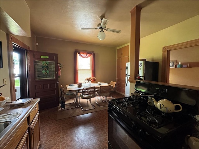 509 N Mercer St, New Castle/1St, PA 16101 - kitchen featuring black gas range oven, ceiling fan, and freestanding refrigerator