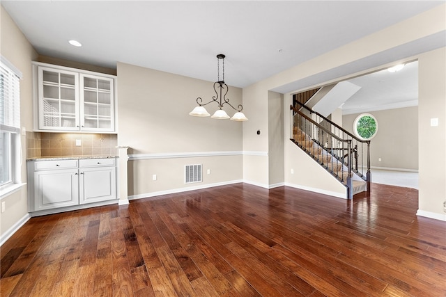 876 Beacon Ln, Mccandless, PA 15237 - unfurnished dining area featuring stairway, wood finished floors, baseboards, and recessed lighting