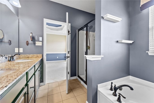876 Beacon Ln, Mccandless, PA 15237 - bathroom featuring a shower stall, a bath, tile patterned floors, double vanity, and baseboards