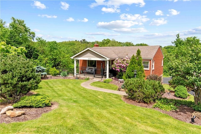 2001 Ewings Mill Rd, Robinson Twp Nwa, PA 15108 - view of front of house with a front yard, a porch, a chimney, and brick siding