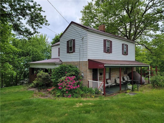 4100 39th Ave, Pulaski Twp Bea, PA 15066 - view of front of property with a chimney, a front yard, stone siding, and a porch
