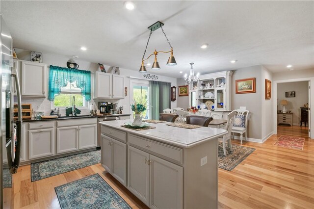 153 Olivia Dr, Center Twp Bea, PA 15061 - kitchen featuring a sink, a center island, a chandelier, light wood finished floors, and recessed lighting