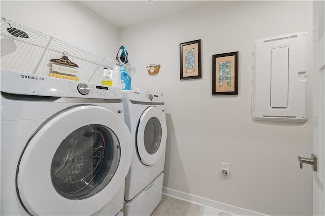 153 Olivia Dr, Center Twp Bea, PA 15061 - washroom featuring washing machine and clothes dryer, baseboards, and light tile patterned floors