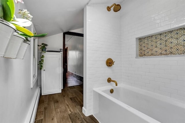 439 Pleasant Hill Rd, Allegheny Twp Wml, PA 15656 - bathroom with wood finished floors, vaulted ceiling, a baseboard radiator, and baseboards