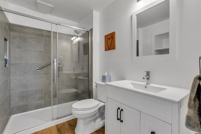 439 Pleasant Hill Rd, Allegheny Twp Wml, PA 15656 - bathroom featuring wood finished floors, toilet, a shower stall, and vanity
