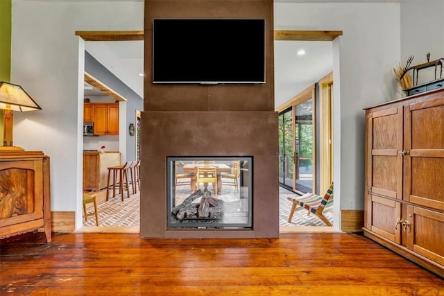 439 Pleasant Hill Rd, Allegheny Twp Wml, PA 15656 - living area featuring hardwood / wood-style flooring, a multi sided fireplace, and recessed lighting