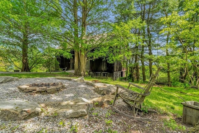 439 Pleasant Hill Rd, Allegheny Twp Wml, PA 15656 - view of yard featuring a fire pit and an outdoor structure