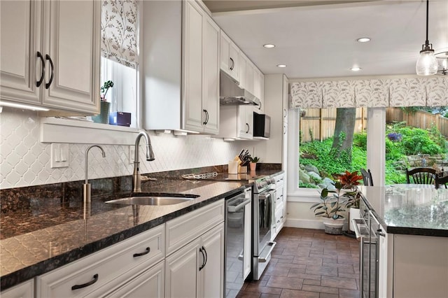 155 Westland Dr, Squirrel Hill, PA 15217 - kitchen featuring a sink, under cabinet range hood, healthy amount of natural light, backsplash, and recessed lighting