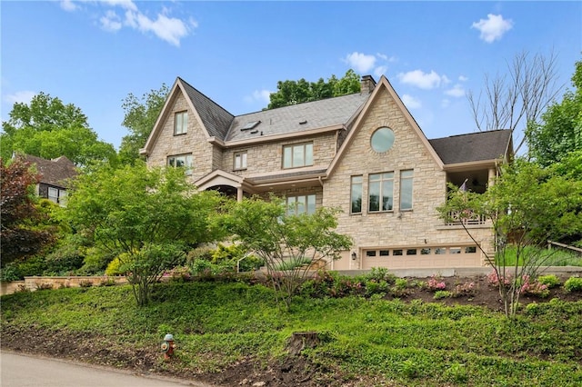 155 Westland Dr, Squirrel Hill, PA 15217 - back of house with stone siding, a chimney, and an attached garage