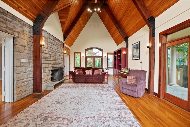 155 Westland Dr, Squirrel Hill, PA 15217 - living room featuring wooden ceiling with exposed beams, wood finished floors, a fireplace, and high vaulted ceiling