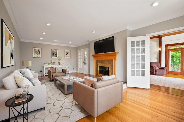 155 Westland Dr, Squirrel Hill, PA 15217 - living area with light wood-style floors, french doors, recessed lighting, a high end fireplace, and crown molding