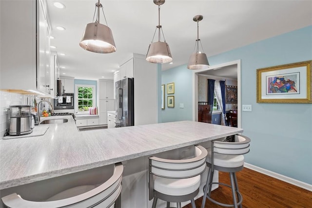 111 Maple Dr, Pine Twp Nal, PA 15090 - kitchen featuring high end fridge, a sink, a peninsula, dark wood finished floors, and white cabinetry