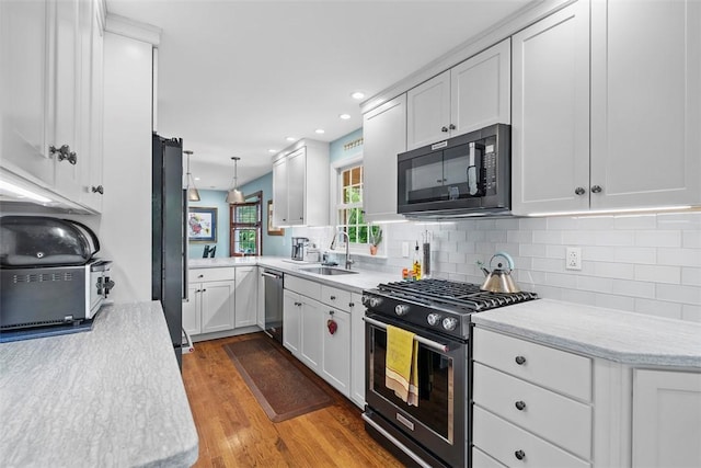 111 Maple Dr, Pine Twp Nal, PA 15090 - kitchen featuring stainless steel appliances, a sink, white cabinetry, backsplash, and recessed lighting