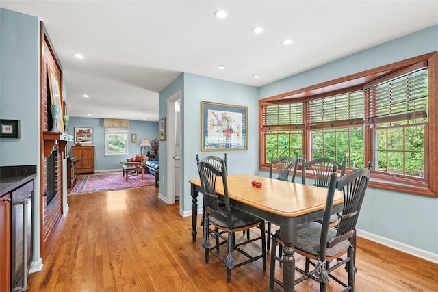 111 Maple Dr, Pine Twp Nal, PA 15090 - dining room featuring wine cooler, baseboards, light wood-style floors, recessed lighting, and a fireplace