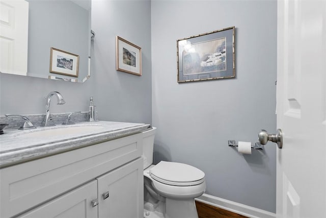 111 Maple Dr, Pine Twp Nal, PA 15090 - bathroom with vanity, baseboards, toilet, and wood finished floors