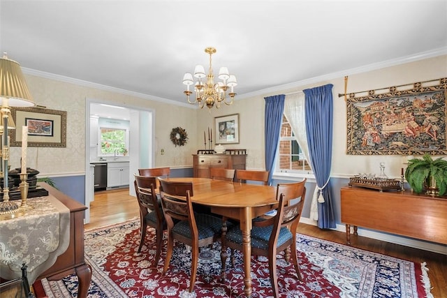 111 Maple Dr, Pine Twp Nal, PA 15090 - dining area with wood finished floors, crown molding, and a chandelier