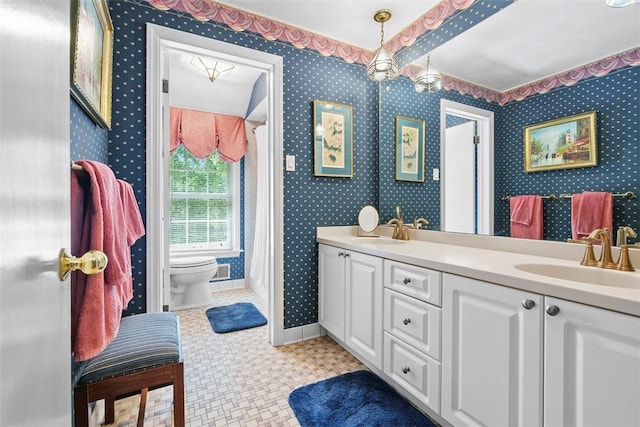 111 Maple Dr, Pine Twp Nal, PA 15090 - bathroom featuring wallpapered walls, toilet, double vanity, and baseboards
