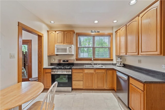 245 Martsolf Ave, West View, PA 15229 - kitchen with appliances with stainless steel finishes, a sink, dark countertops, recessed lighting, and light tile patterned flooring