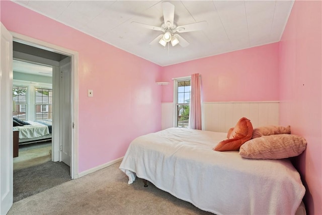 245 Martsolf Ave, West View, PA 15229 - carpeted bedroom featuring multiple windows, a ceiling fan, and wainscoting