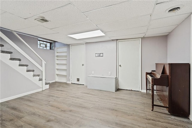 245 Martsolf Ave, West View, PA 15229 - below grade area featuring wood finished floors, stairs, a paneled ceiling, and baseboards