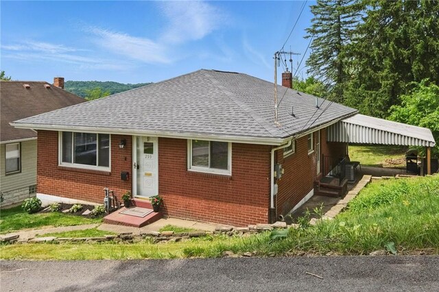 259 Allison Ave, Emsworth, PA 15202 - bungalow-style house with brick siding, roof with shingles, and a chimney