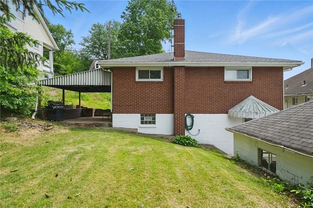 259 Allison Ave, Emsworth, PA 15202 - back of house featuring a chimney, a yard, brick siding, and roof with shingles