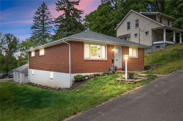 259 Allison Ave, Emsworth, PA 15202 - view of front of house with brick siding, a front yard, and roof with shingles