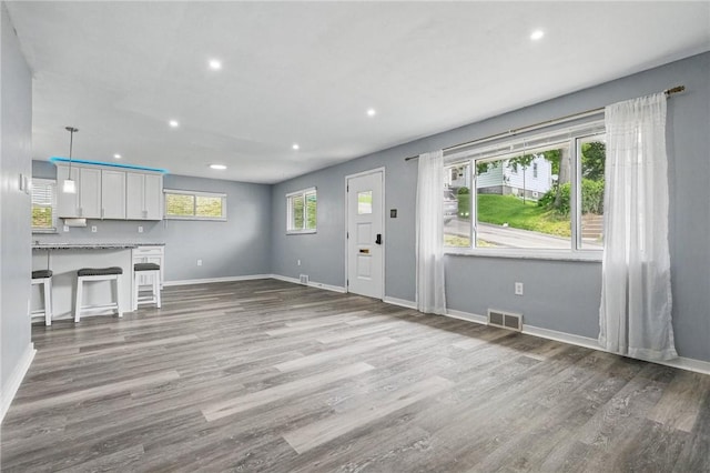 259 Allison Ave, Emsworth, PA 15202 - unfurnished living room featuring baseboards, recessed lighting, and wood finished floors