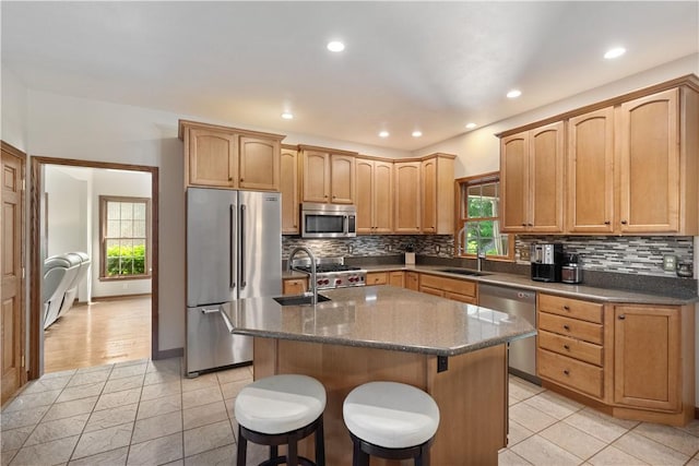 321 Ivy Dr, Pine Twp Nal, PA 15044 - kitchen with stainless steel appliances, a sink, light tile patterned floors, an island with sink, and recessed lighting