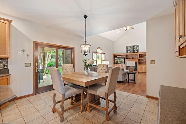 321 Ivy Dr, Pine Twp Nal, PA 15044 - dining space with light tile patterned floors and high vaulted ceiling